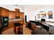 Spacious kitchen with wood cabinets, black countertops, stainless appliances and center island at 1570 Preserve Way, Clearwater, FL 33764