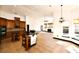 Open kitchen features wooden cabinetry, an island with seating, and a view of the living area at 1570 Preserve Way, Clearwater, FL 33764