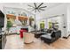 Cozy living room with a modern fireplace, sleek furniture, large windows, and a view to the screened-in patio at 1570 Preserve Way, Clearwater, FL 33764