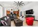 Inviting living room featuring a modern ceiling fan, comfortable seating, and an open view to the kitchen at 1570 Preserve Way, Clearwater, FL 33764