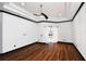 The spacious main bedroom features hardwood floors and a ceiling fan at 1570 Preserve Way, Clearwater, FL 33764