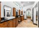 Elegant bathroom with double vanity, granite counters, and soaking tub at 1570 Preserve Way, Clearwater, FL 33764