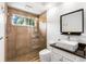 Modern bathroom with a walk-in shower and floating vanity at 1570 Preserve Way, Clearwater, FL 33764