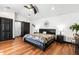 Spacious bedroom with king-size bed and hardwood floors at 1570 Preserve Way, Clearwater, FL 33764