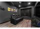 Elegant home theater room featuring a leather sofa and large screen at 1570 Preserve Way, Clearwater, FL 33764
