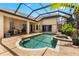 Relaxing pool and spa with a covered patio, perfect for entertaining at 1570 Preserve Way, Clearwater, FL 33764