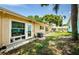 Backyard view with patio, AC unit, and grassy area at 2465 Northside Dr # 702, Clearwater, FL 33761