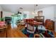 Bright dining room with hardwood floors and a wood table, offering an open concept at 2465 Northside Dr # 702, Clearwater, FL 33761