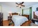 Comfortable bedroom with ceiling fan and wicker furniture at 2465 Northside Dr # 702, Clearwater, FL 33761