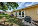Backyard view showing patio, AC units, and grassy area at 2465 Northside Dr # 702, Clearwater, FL 33761
