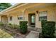Inviting exterior of condo, featuring a covered entryway and well-manicured landscaping at 2465 Northside Dr # 702, Clearwater, FL 33761