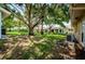 Shared backyard with mature trees and grassy areas at 2465 Northside Dr # 702, Clearwater, FL 33761