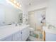 Clean bathroom with shower/tub combo, vanity, and linen storage at 2465 Northside Dr # 702, Clearwater, FL 33761