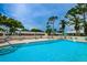 Inviting community pool with surrounding patio furniture at 2465 Northside Dr # 702, Clearwater, FL 33761