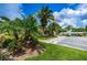 Exterior view of a condo building with palm trees and parking at 2465 Northside Dr # 702, Clearwater, FL 33761