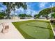 Community putting green with bench and landscaping at 2465 Northside Dr # 702, Clearwater, FL 33761