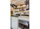 Laundry closet with washer, dryer, and storage shelves at 2465 Northside Dr # 702, Clearwater, FL 33761