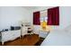 Bedroom with wood floors, desk, and neutral decor at 2465 Northside Dr # 702, Clearwater, FL 33761
