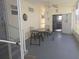 Enclosed patio with table and chairs at 29 Concord Ln # 11, Palm Harbor, FL 34684