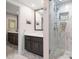 Updated bathroom with a walk-in shower and double vanity at 150 Belleview Blvd # 704, Belleair, FL 33756