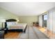 Bright bedroom with king-size bed and hardwood floors at 150 Belleview Blvd # 704, Belleair, FL 33756