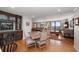 Open dining area with built-in cabinetry and hardwood floors at 150 Belleview Blvd # 704, Belleair, FL 33756