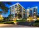 Well-maintained condominium with balconies, beautiful landscaping, and covered parking spaces at 150 Belleview Blvd # 704, Belleair, FL 33756