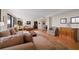 Spacious living room with hardwood floors, ample seating, and views at 150 Belleview Blvd # 704, Belleair, FL 33756