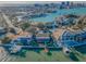 Captivating aerial view of a waterfront home on a peninsula, with a private dock and stunning water views at 526 Belle Isle Ave, Belleair Beach, FL 33786
