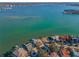 Luxury homes lining a scenic bay with private docks offer direct water access at 526 Belle Isle Ave, Belleair Beach, FL 33786