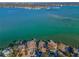 Stunning waterfront homes with private docks against a beautiful turquoise bay backdrop at 526 Belle Isle Ave, Belleair Beach, FL 33786