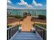 Brick steps lead to dock and beautiful water view at 526 Belle Isle Ave, Belleair Beach, FL 33786