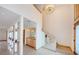 Bright foyer with marble floors, high ceilings, and a staircase with glass panels at 526 Belle Isle Ave, Belleair Beach, FL 33786