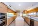 Bright kitchen with island, stainless appliances, and ample counter space at 526 Belle Isle Ave, Belleair Beach, FL 33786