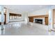 Open living space featuring a fireplace and large windows, creating a warm, inviting atmosphere at 526 Belle Isle Ave, Belleair Beach, FL 33786