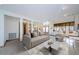 Spacious open living room featuring modern decor, lots of light, and luxury flooring at 526 Belle Isle Ave, Belleair Beach, FL 33786