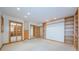 Bright living room with custom built-ins and access to the walk-in closet providing seamless storage at 526 Belle Isle Ave, Belleair Beach, FL 33786