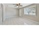 Light-filled living room with tile floors and a window at 3353 Columbus Dr, Holiday, FL 34691