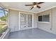 Screened porch with French doors and backyard access at 3353 Columbus Dr, Holiday, FL 34691