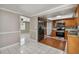 Bright kitchen with stainless steel appliances and wood-look flooring at 3353 Columbus Dr, Holiday, FL 34691