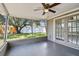 Screened porch with French doors and backyard view at 3353 Columbus Dr, Holiday, FL 34691