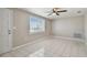 Simple bedroom with tile floors and a window at 3353 Columbus Dr, Holiday, FL 34691