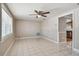 Bright living room with tile floors and ceiling fan at 3353 Columbus Dr, Holiday, FL 34691