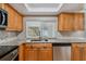 Modern kitchen featuring granite countertops and sink at 3353 Columbus Dr, Holiday, FL 34691