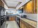 Modern kitchen with granite countertops and stainless steel appliances at 2775 Kipps Colony S Dr # 204, St Petersburg, FL 33707