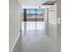 Open living area with tile floors and water views at 2775 Kipps Colony S Dr # 204, St Petersburg, FL 33707