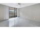 Bright bedroom with tile floors and balcony access at 2775 Kipps Colony S Dr # 204, St Petersburg, FL 33707