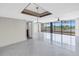 Spacious living room with water views and tile floor at 2775 Kipps Colony S Dr # 204, St Petersburg, FL 33707