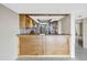 Kitchen features granite countertops and wood cabinets at 2775 Kipps Colony S Dr # 204, St Petersburg, FL 33707