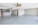 Spacious living room with tile floors and access to a balcony with water views at 2775 Kipps Colony S Dr # 204, St Petersburg, FL 33707